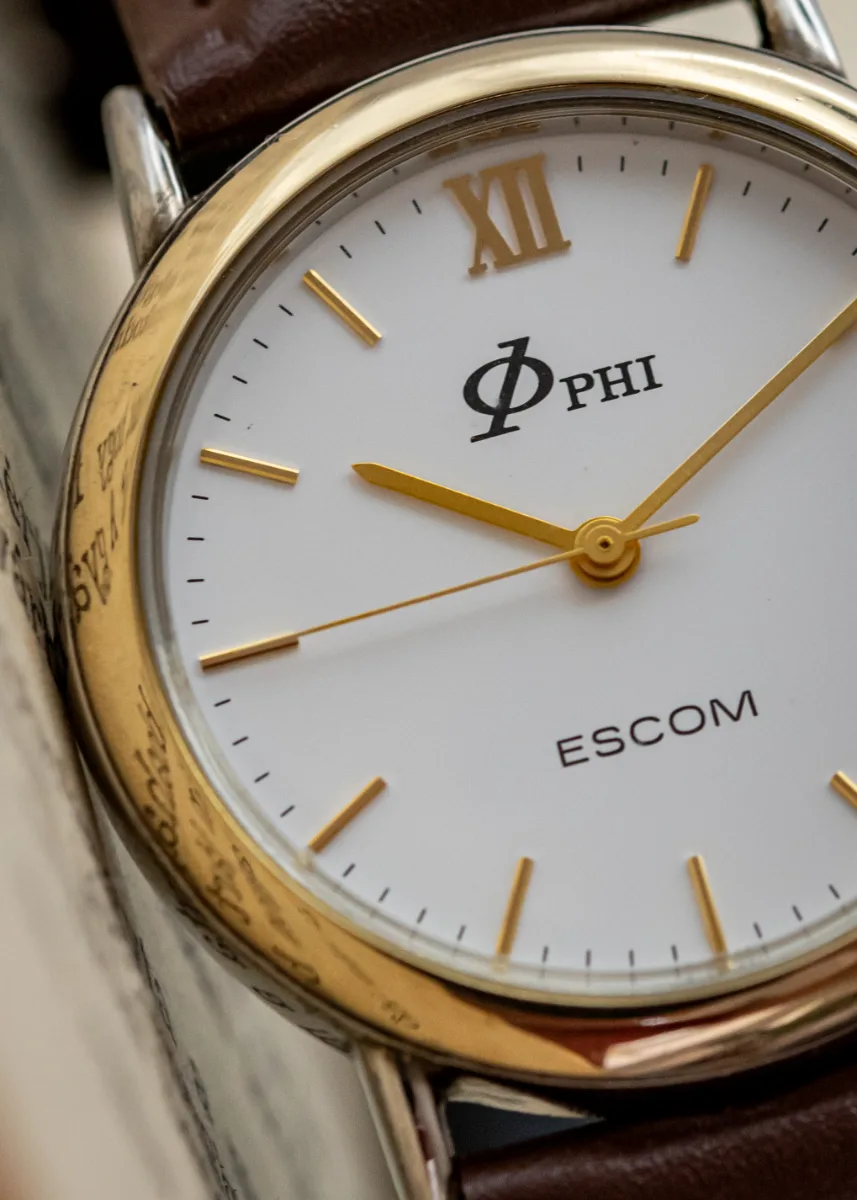 Escom — Phi